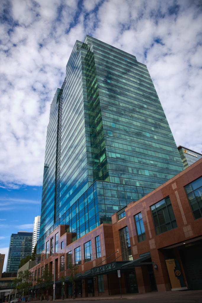 A vertical shot of a glass building